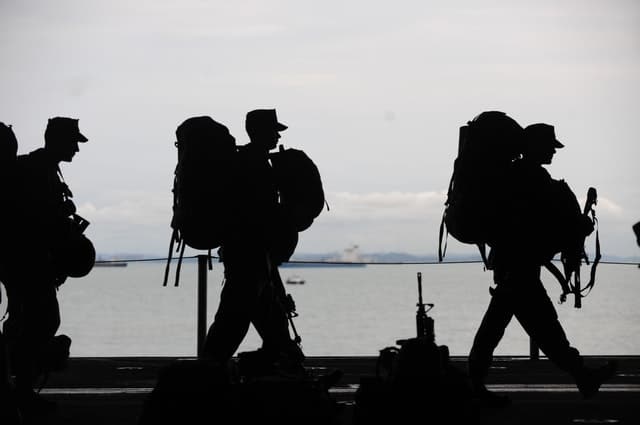 Soldier marching with backpacks
