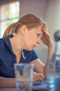 Annoying Workplace Habits Woman looking annoyed at work