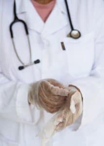 healthcare workers crop-doctor-with-stethoscope-preparing-for-surgery-in-3825586