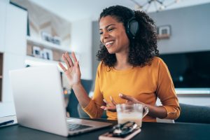 woman working from home talking to someone in video chat