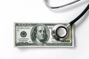 Stethoscope on a 100 dollar bill