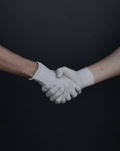 people-shaking-hands-in-latex-gloves